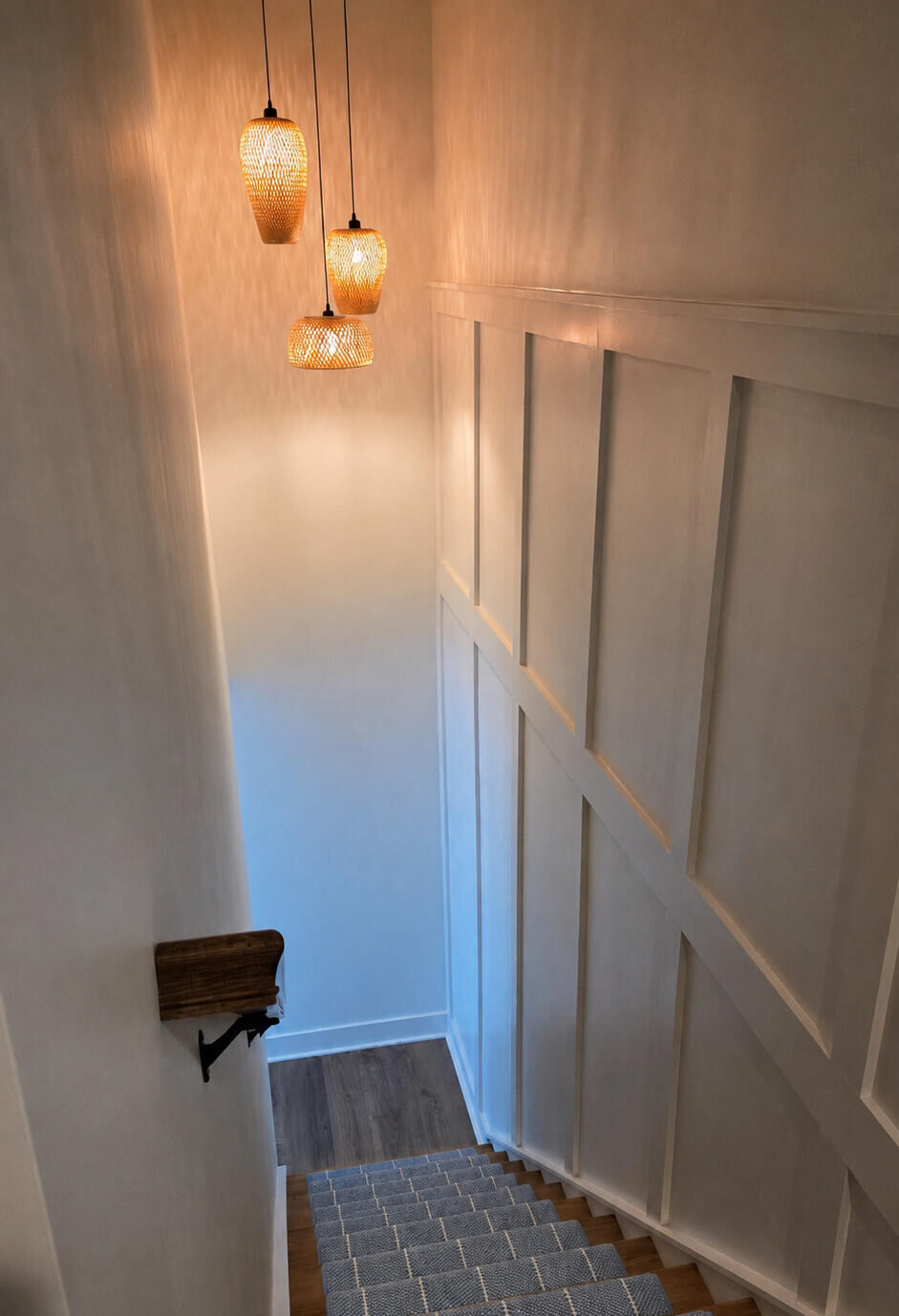 Custom stair millwork with pendant lighting
